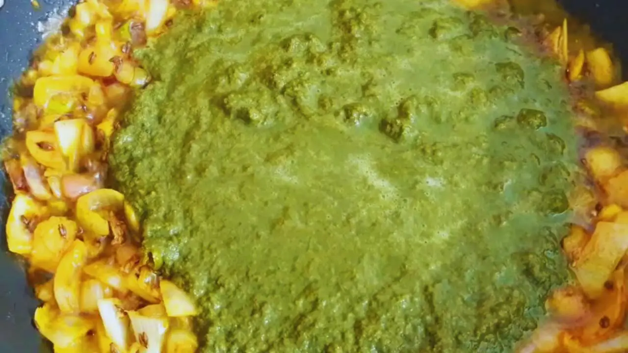 Pouring the curry leaves paste