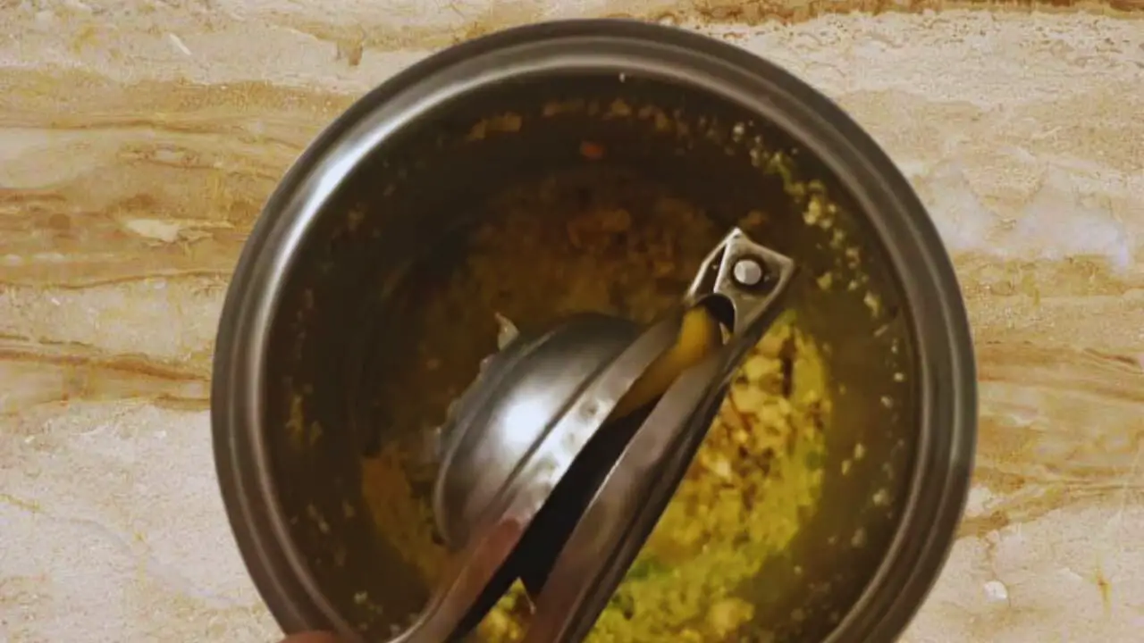 Squeezing another teaspoon of fresh lime juice into the content