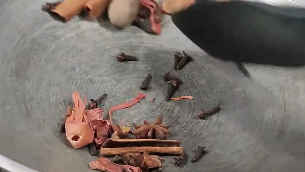 Stirring the spices continuously