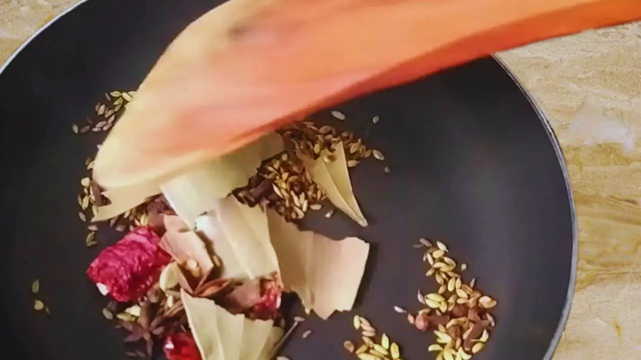 Stirring the spices continuously