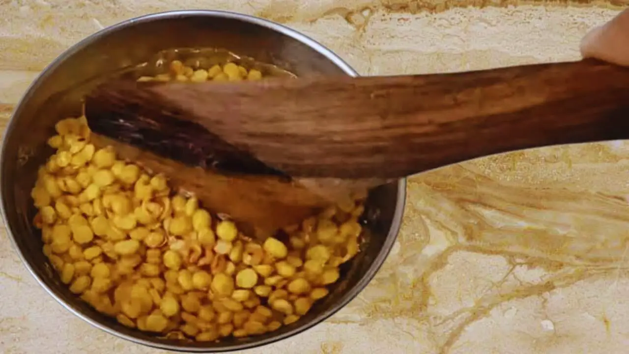Stirring to make sure every piece is soaked nicely in water
