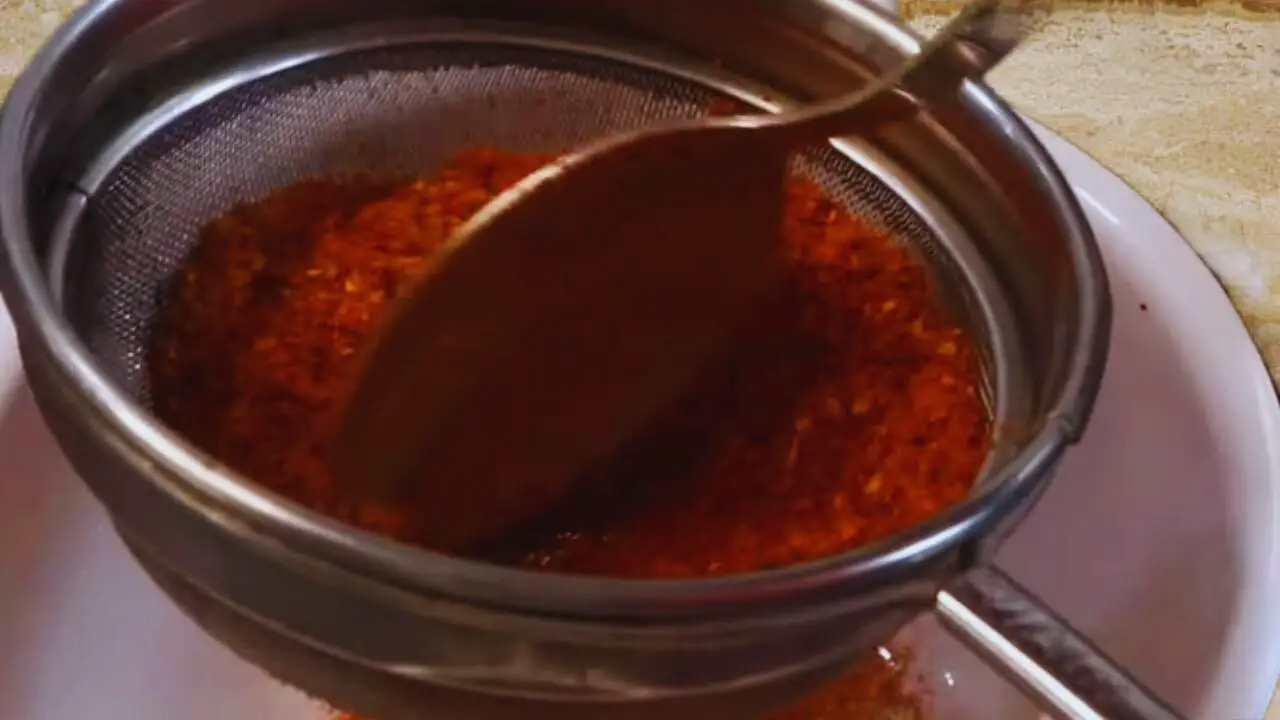 Straining the ground spices