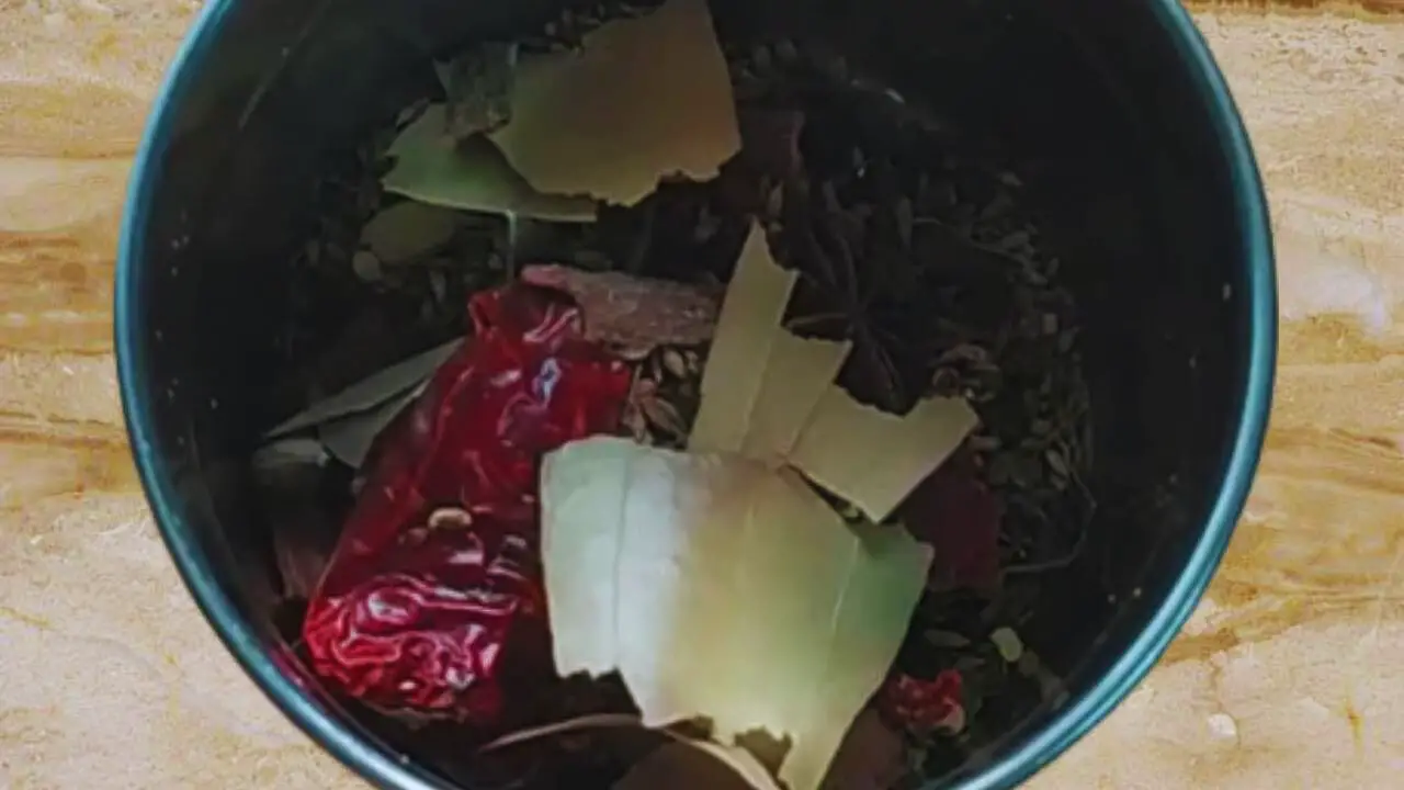 Transferring the cool spices into the grinder