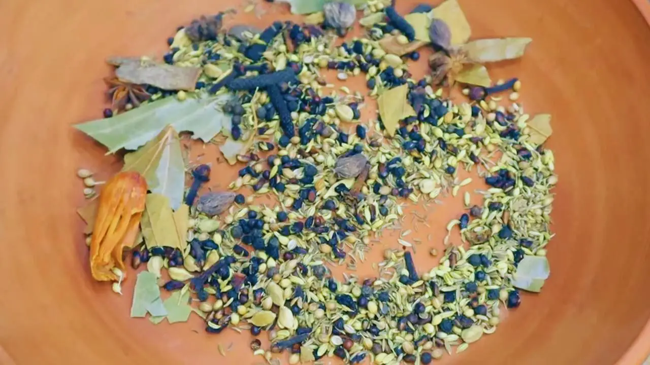 Transferring the roasted spices into a separate plate