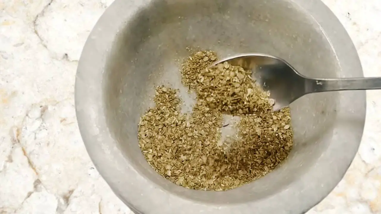 Grinding the spices until you get a coarse powder