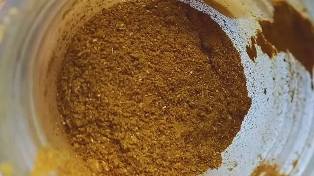 Grinding the spices and other ingredients into a fine powder