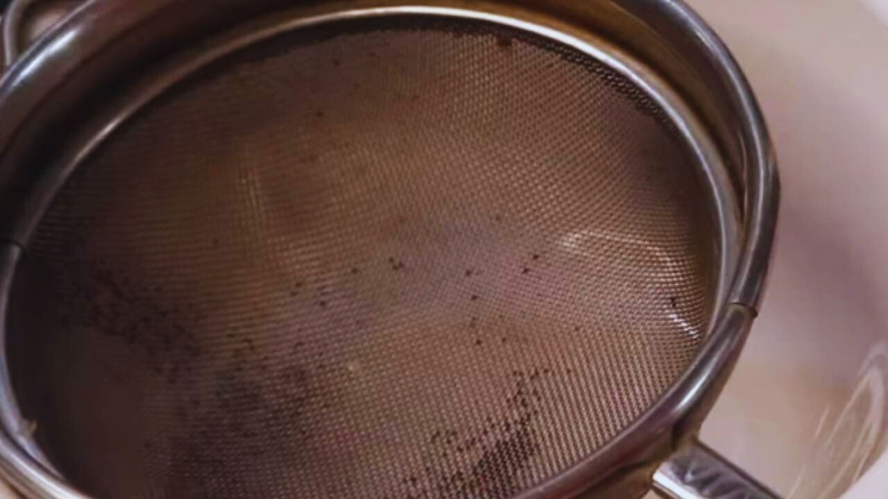 Taking a strainer and place it over a bowl