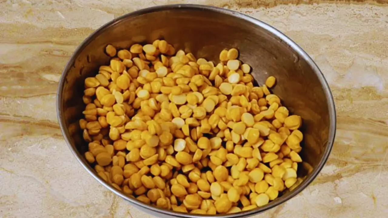 Taking 1 cup of split chickpea lentils (chana dal) in a bowl