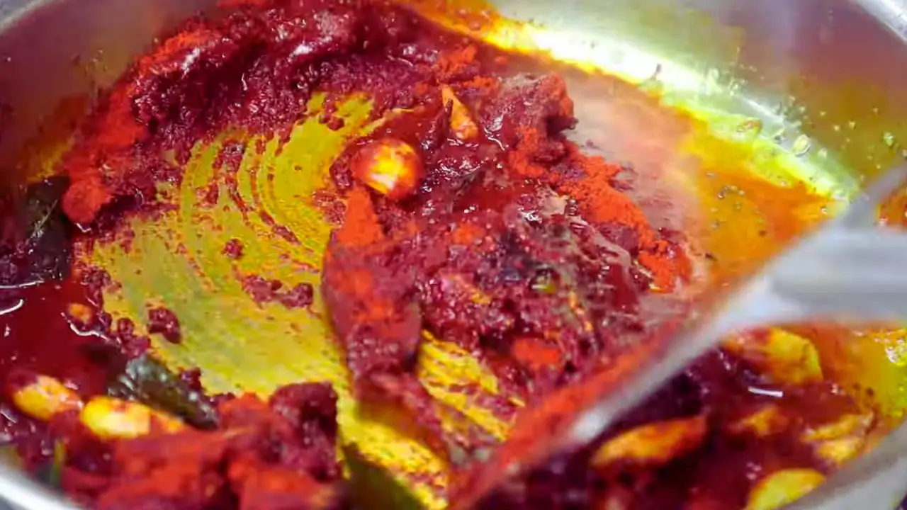 Added 4 tbsp asafoetida, 1 tbsp fenugreek powder, and 4 tbsp Kashmiri red chili powder