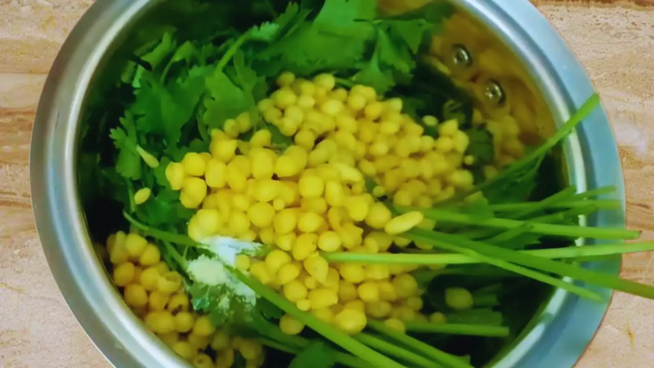 Adding about ½ cup of small besan or gram flour balls (boondi) to the grinder