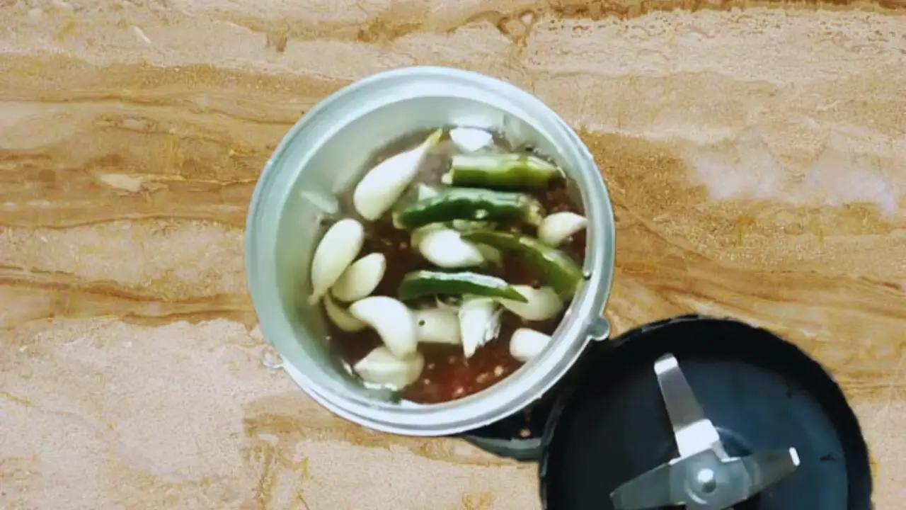 Adding 2 pieces of fresh green chilies