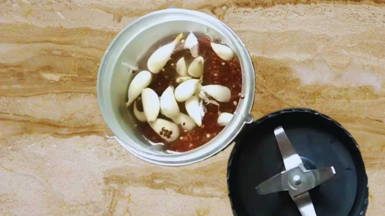 Adding 12 to 15 deskinned, fresh garlic cloves