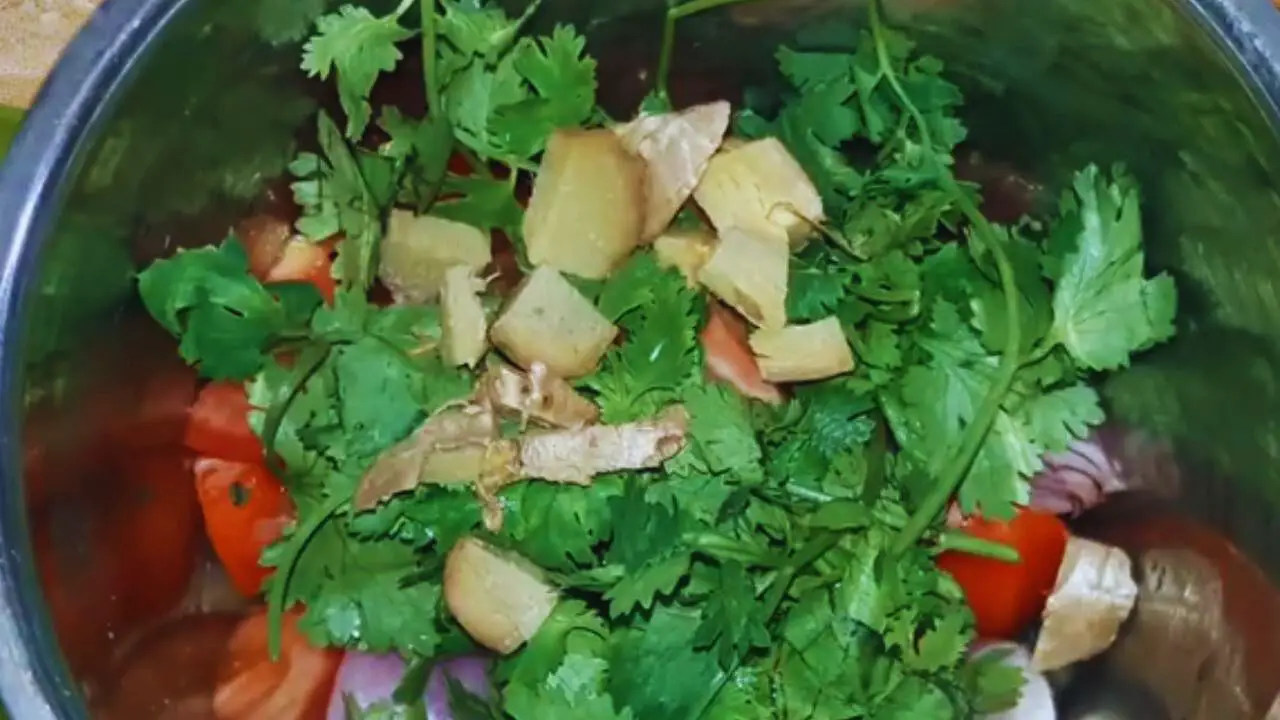 Adding ginger to the black sesame chutney ingredients