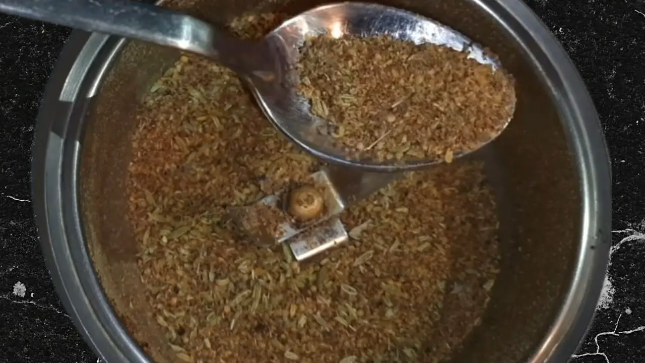 Grinding the spices into a coarse powder