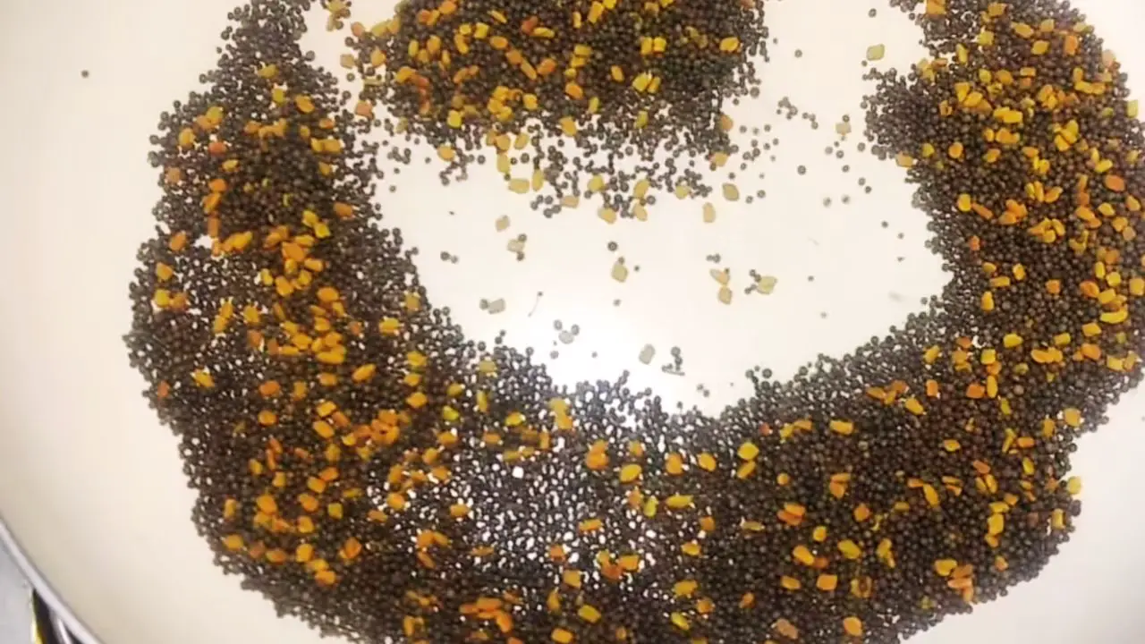 Dru roasting 1 cup black mustard seeds and 2 tbsp fenugreek seeds