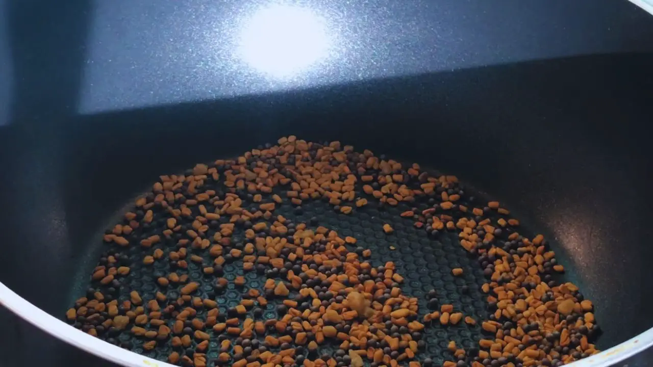 Dry roasting 1 tablespoon of fenugreek seeds, 1 teaspoon of black mustard seeds, and 1/4 teaspoon of asafoetida