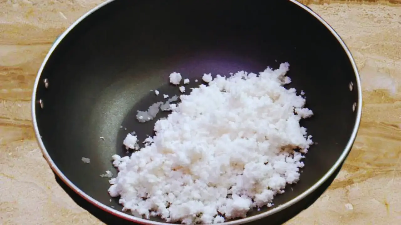 Ground coconut in frying pan