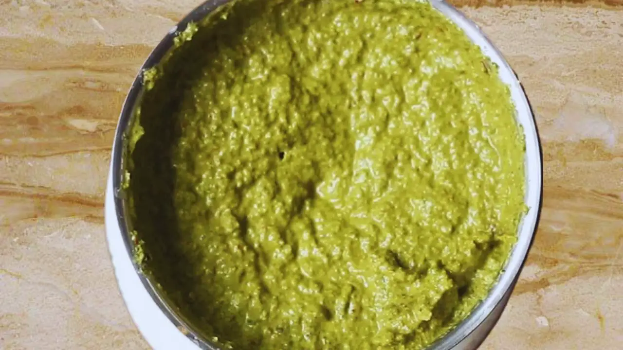 Grinding the ingredients to a fine paste