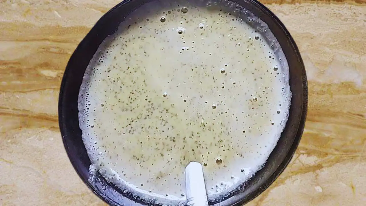 Setting the bowl with the mustard paste aside