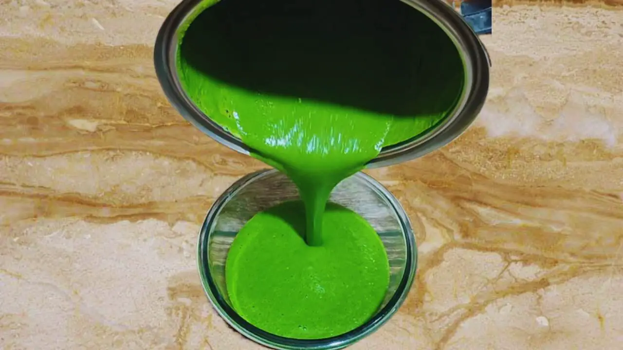 Pouring the paste from the grinder into the bowl