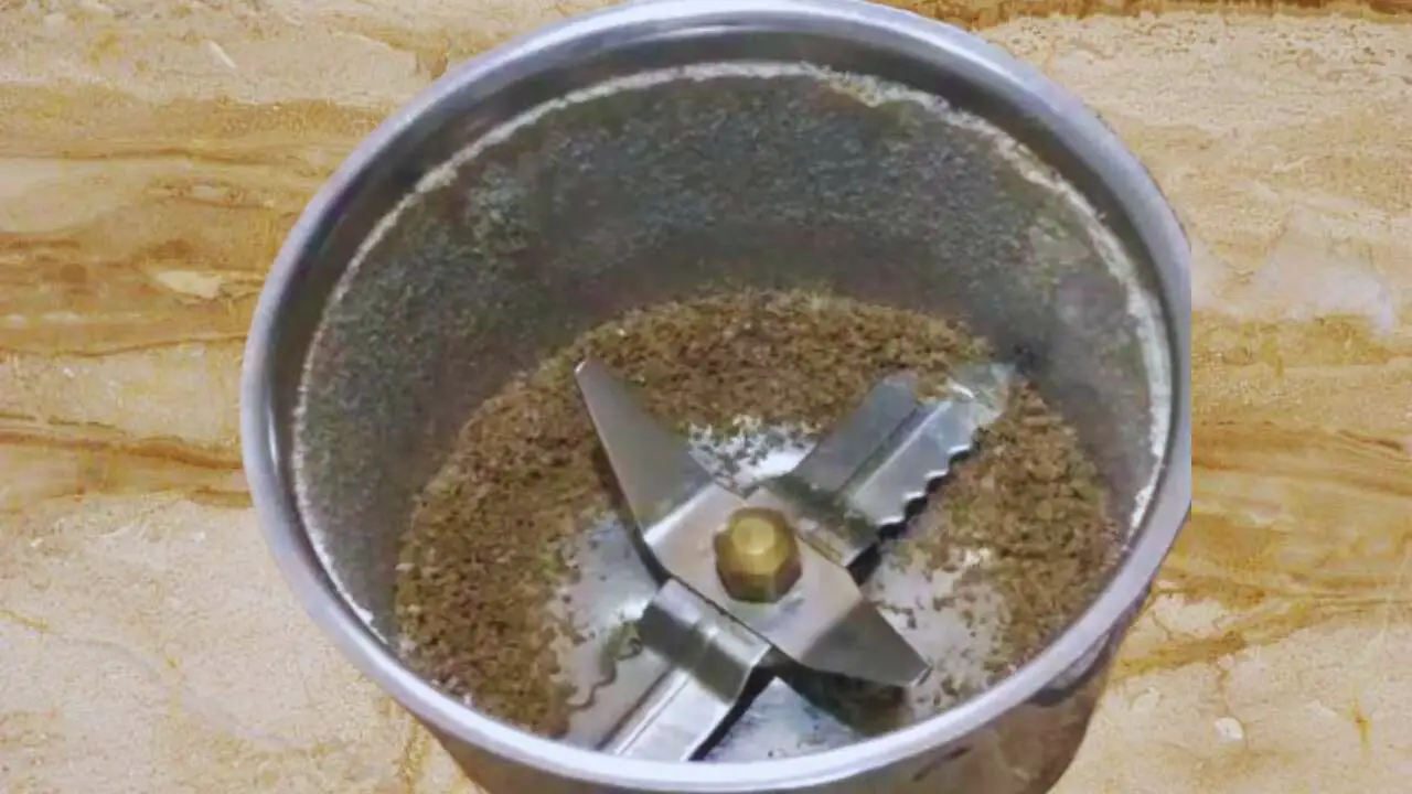 Transfer the roasted spices to grinder