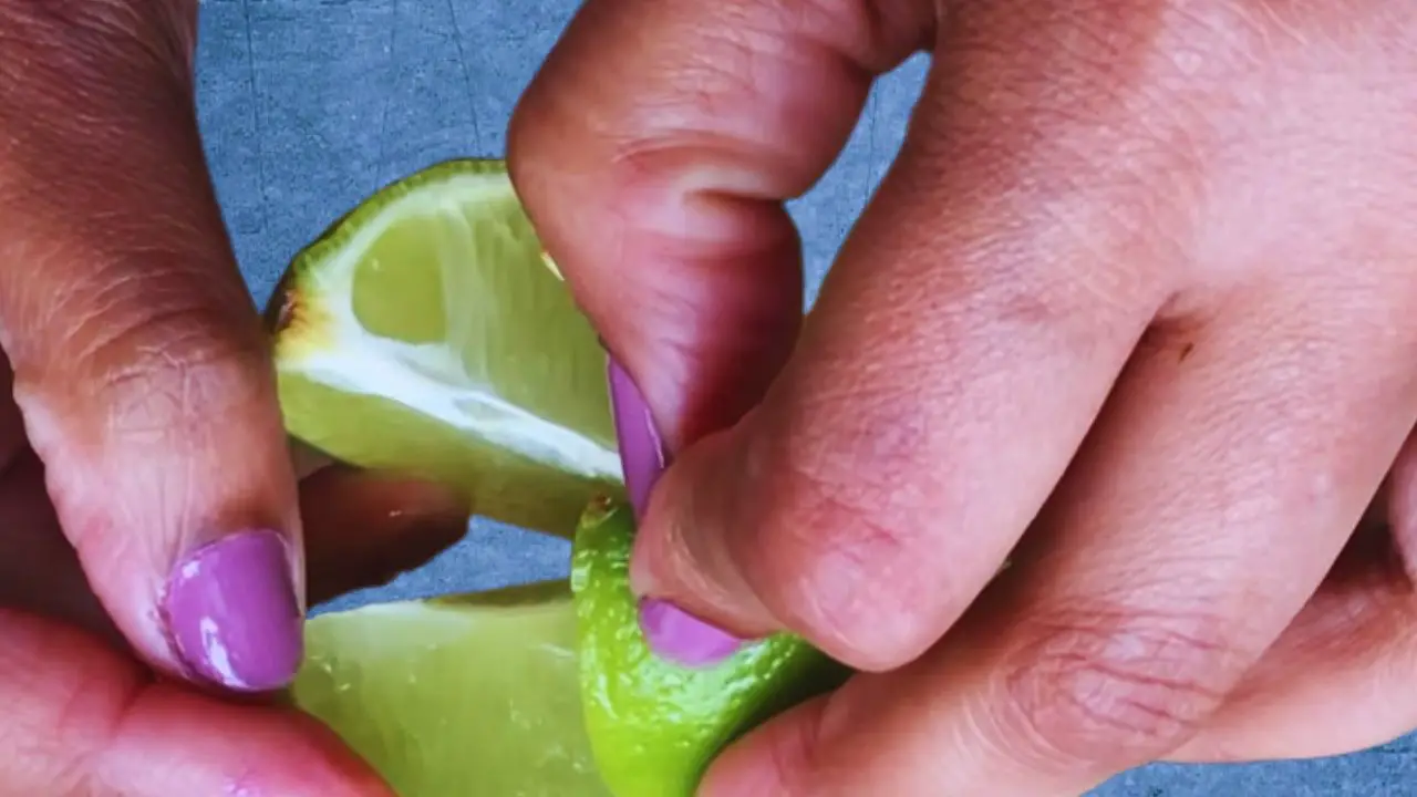 Slitting the lemons lengthwise and removing seeds