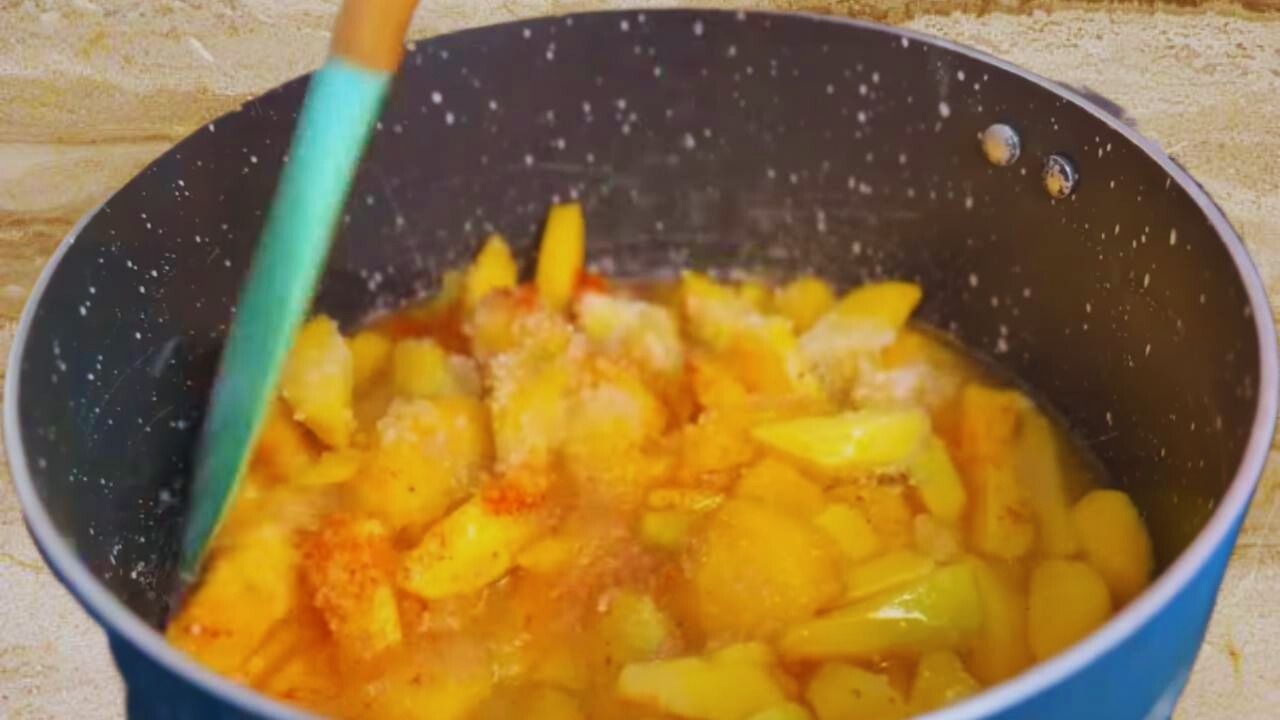 Stirring the ingredients in the wok