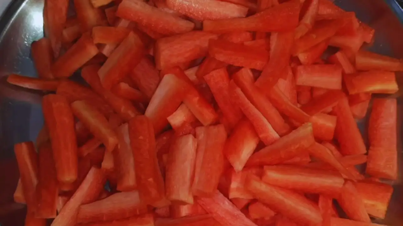 Cutting the carrots into thin pieces