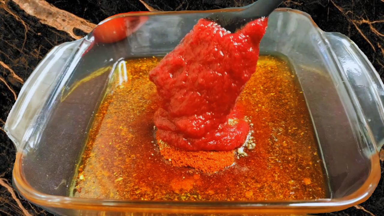 Adding the tomato pulp into the mixing bowl
