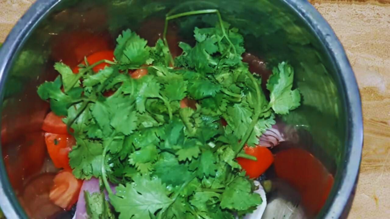 Adding about ½ cup of fresh coriander leaves in the grinder