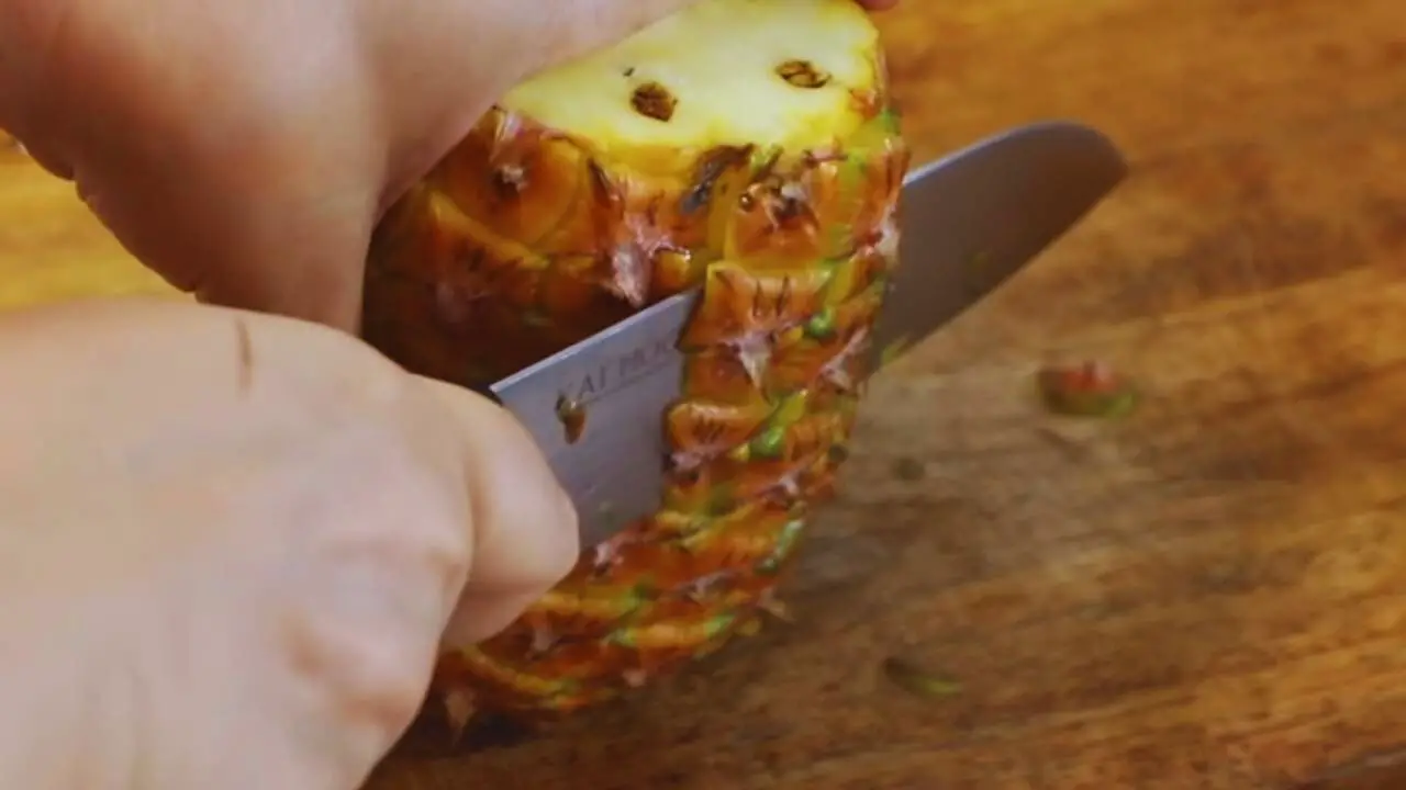 Peeling pineapple