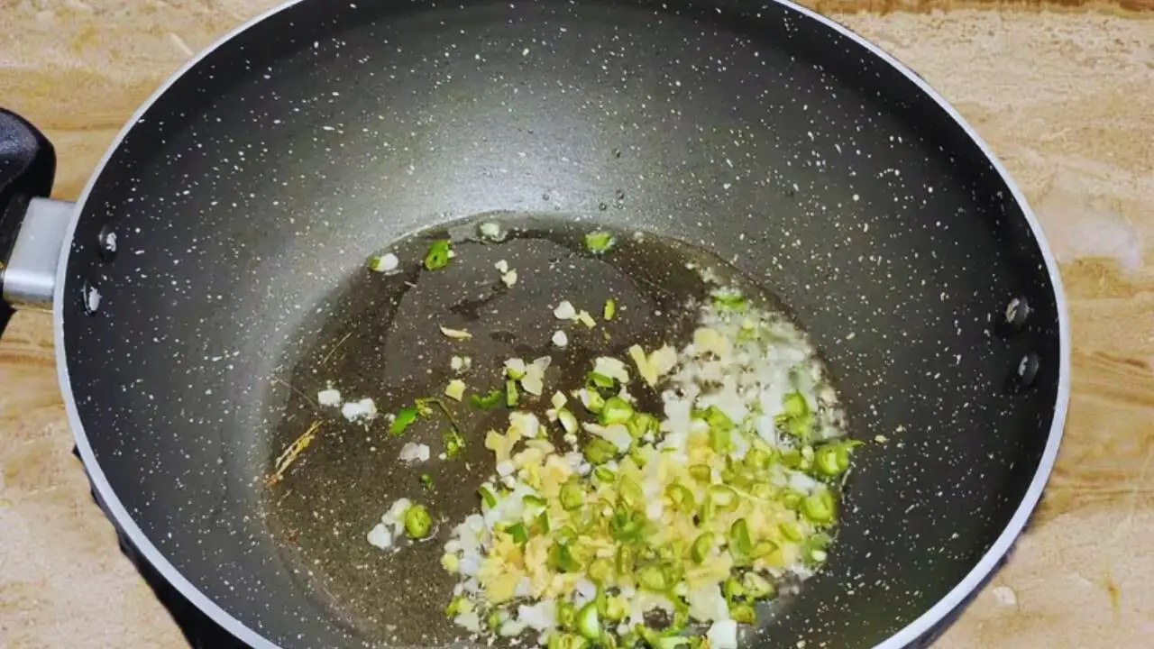 Adding green chilies to make vegetable kabab