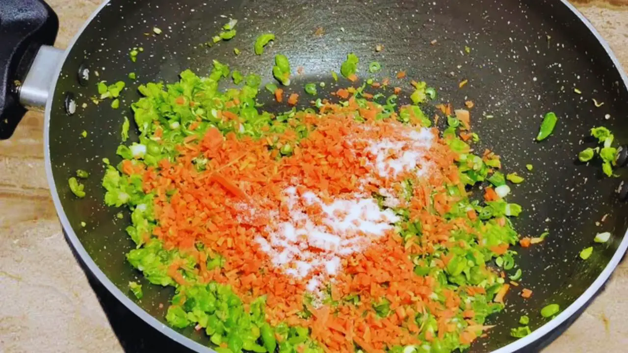 Adding salt to the vegetable kabab ingredients 