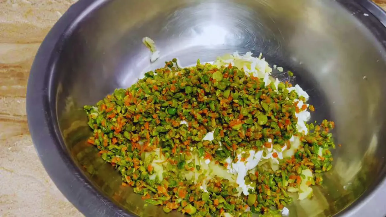 Adding the cooked vegetables to make kababs 