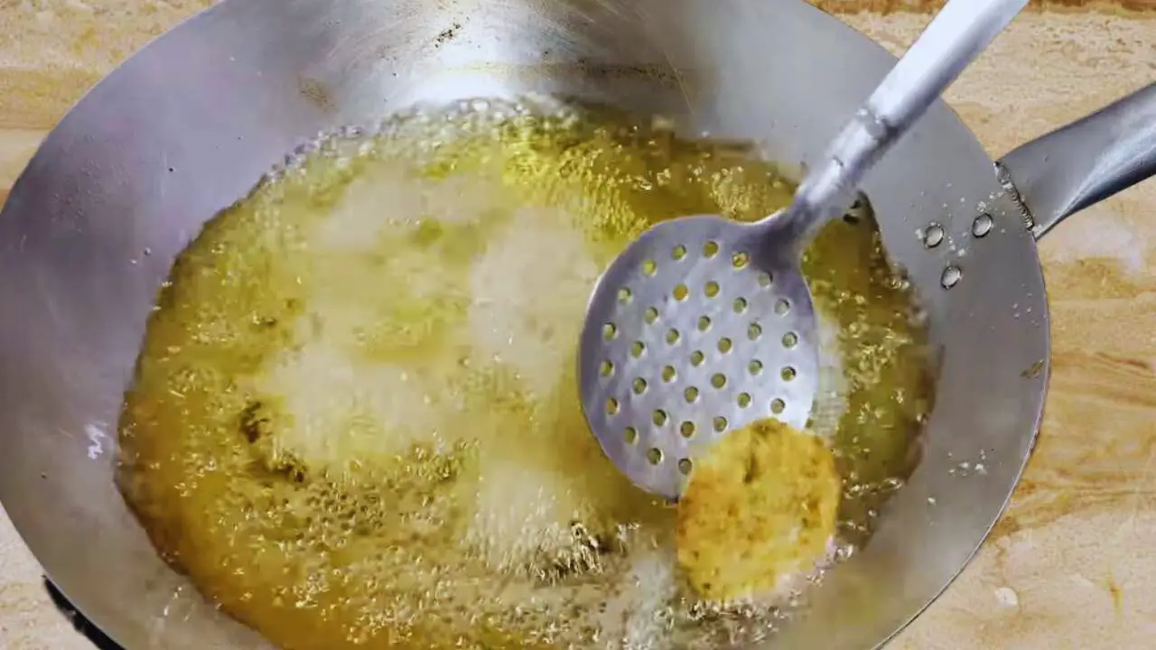 Flipping and frying vegetable kababs 