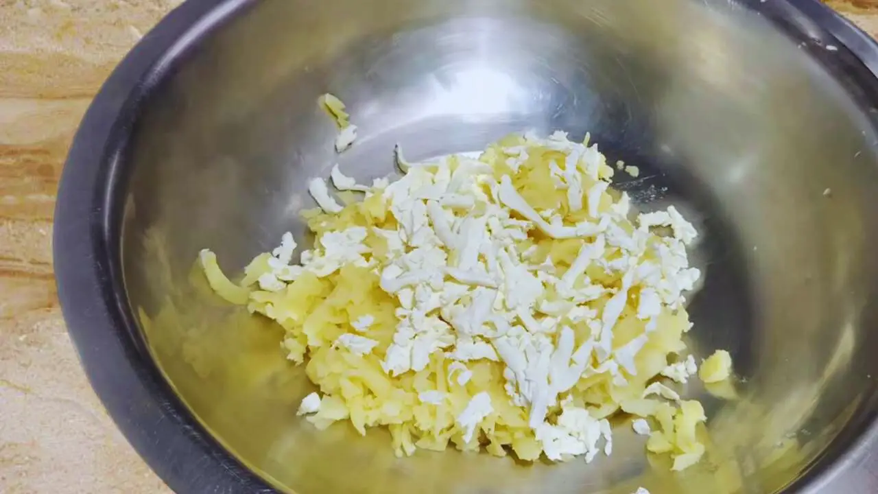 Grating paneer to add to vegetable kabab 