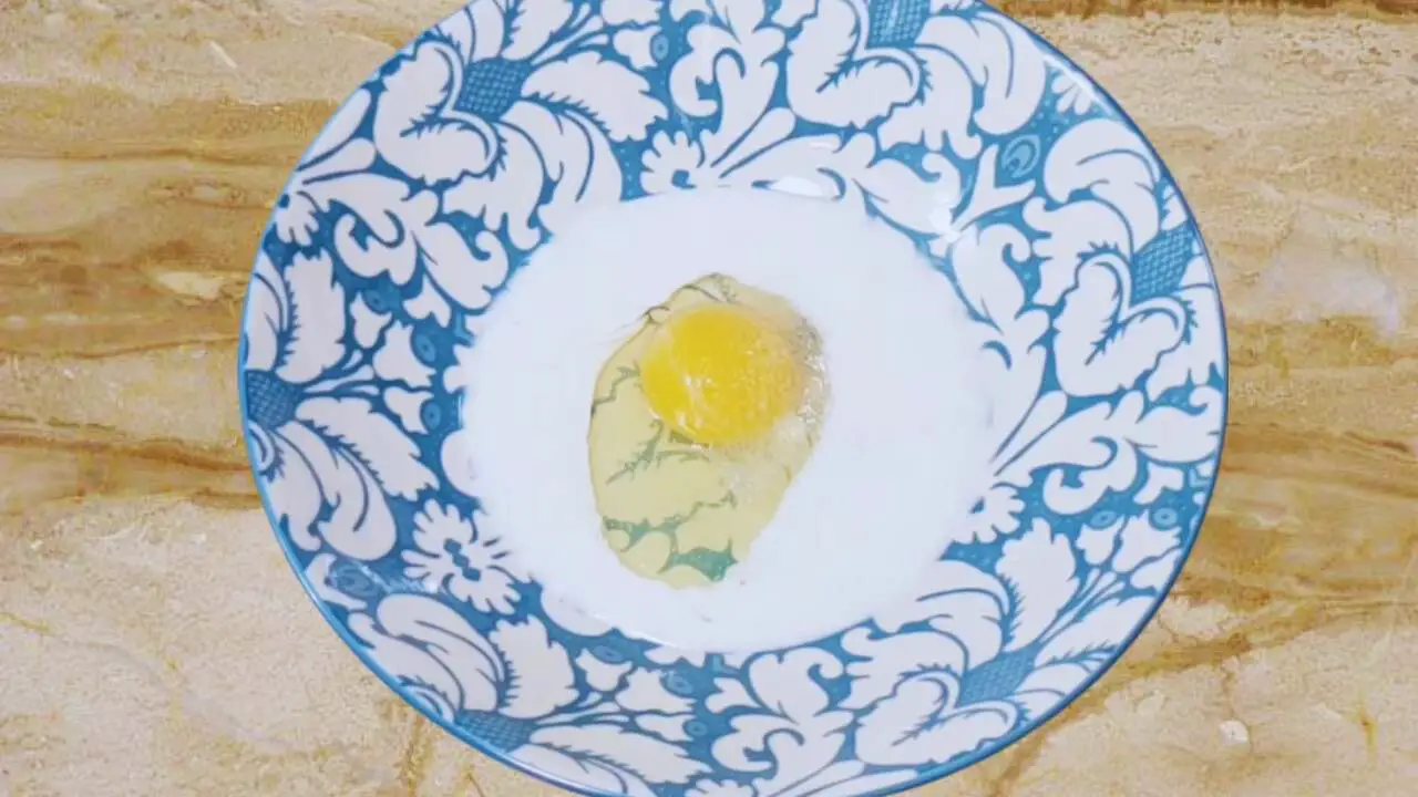 Ingredients to make the egg wash for coating cheese stick