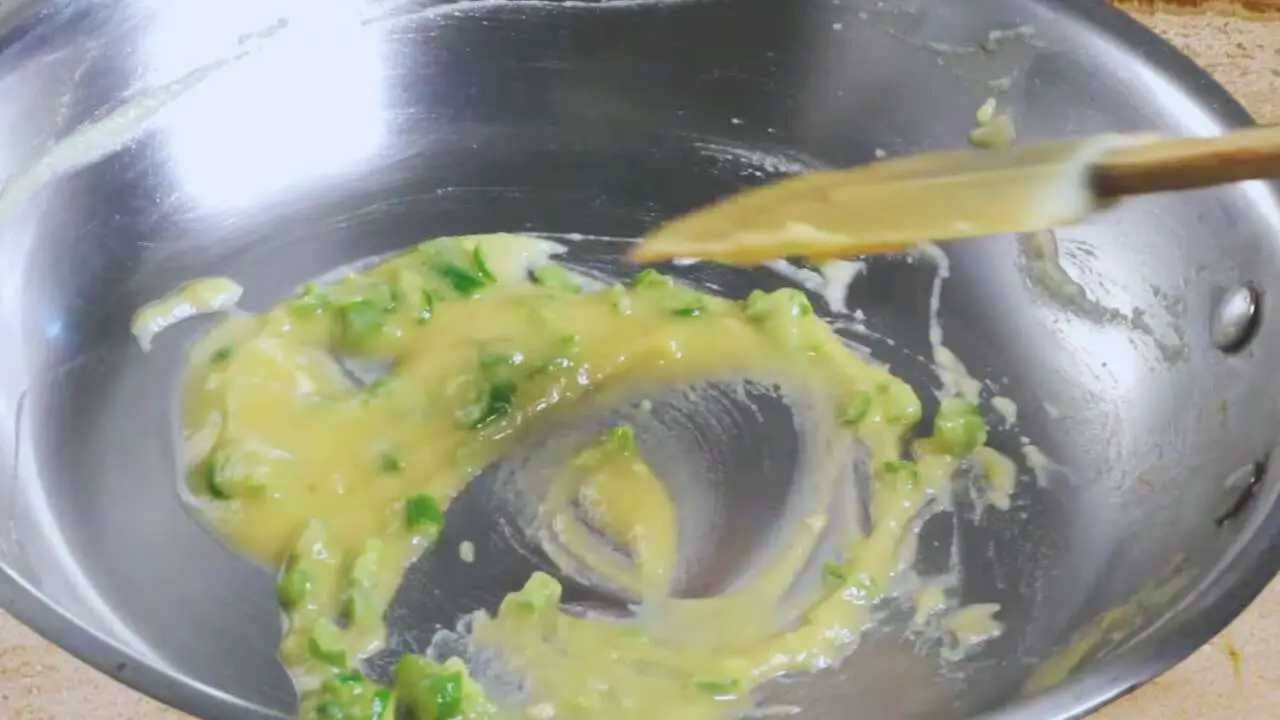Mixing maida to make the roux for the chicken finger mixture 