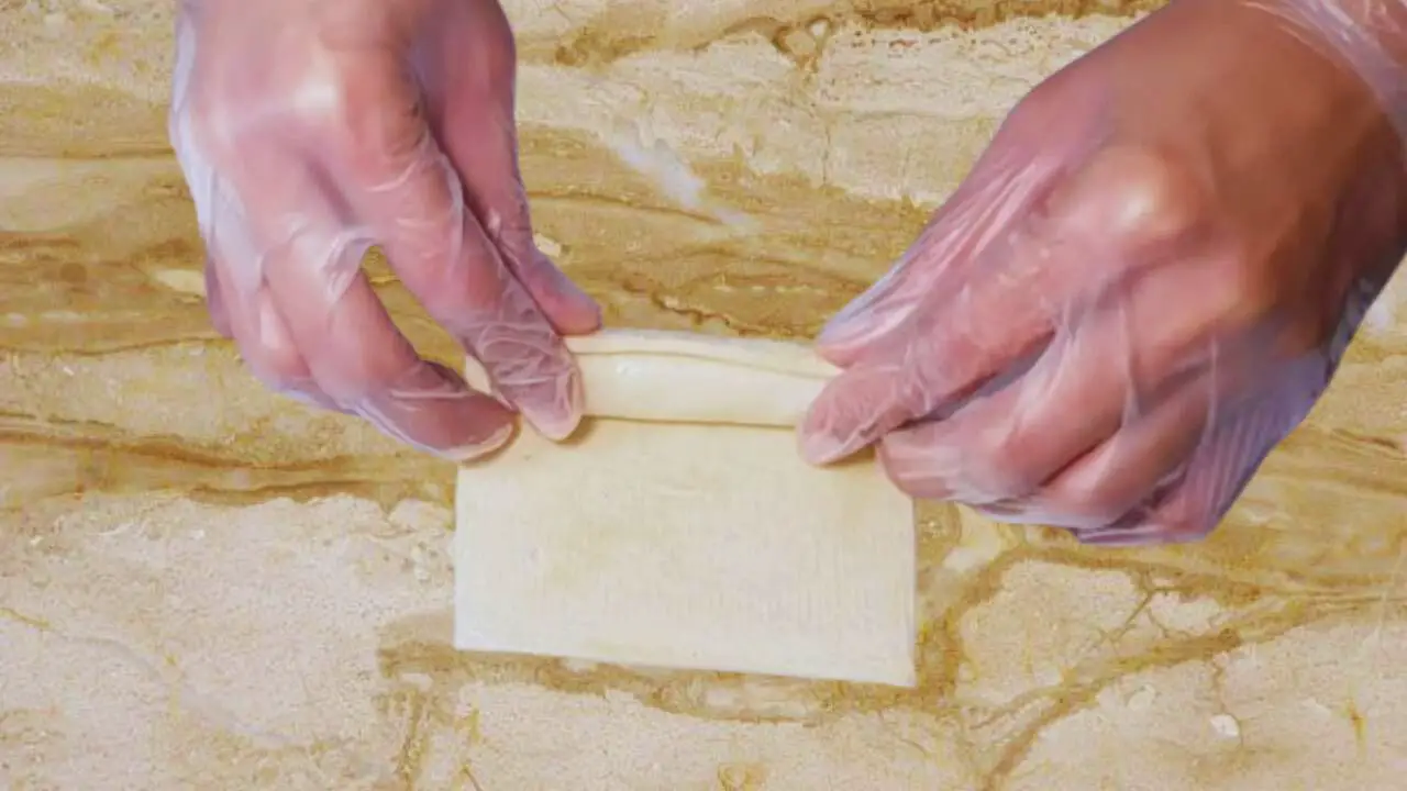 Rolling bread and cheese stick