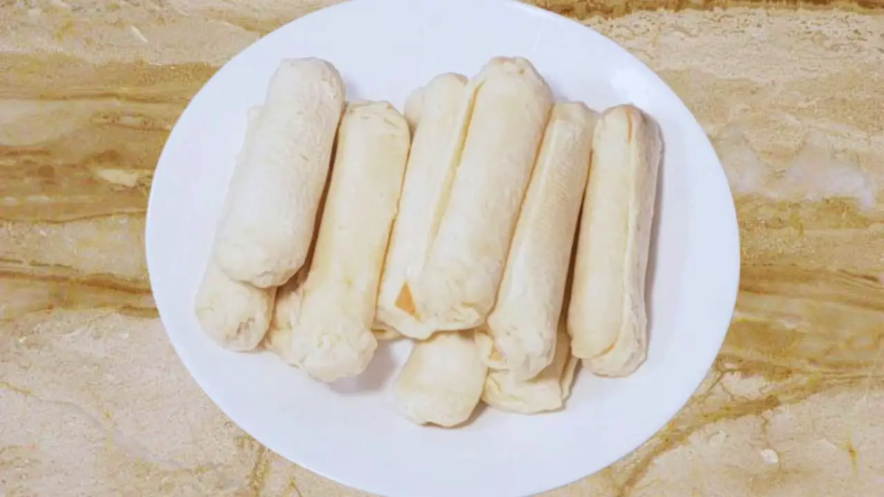 Sealed cheese sticks on a plate