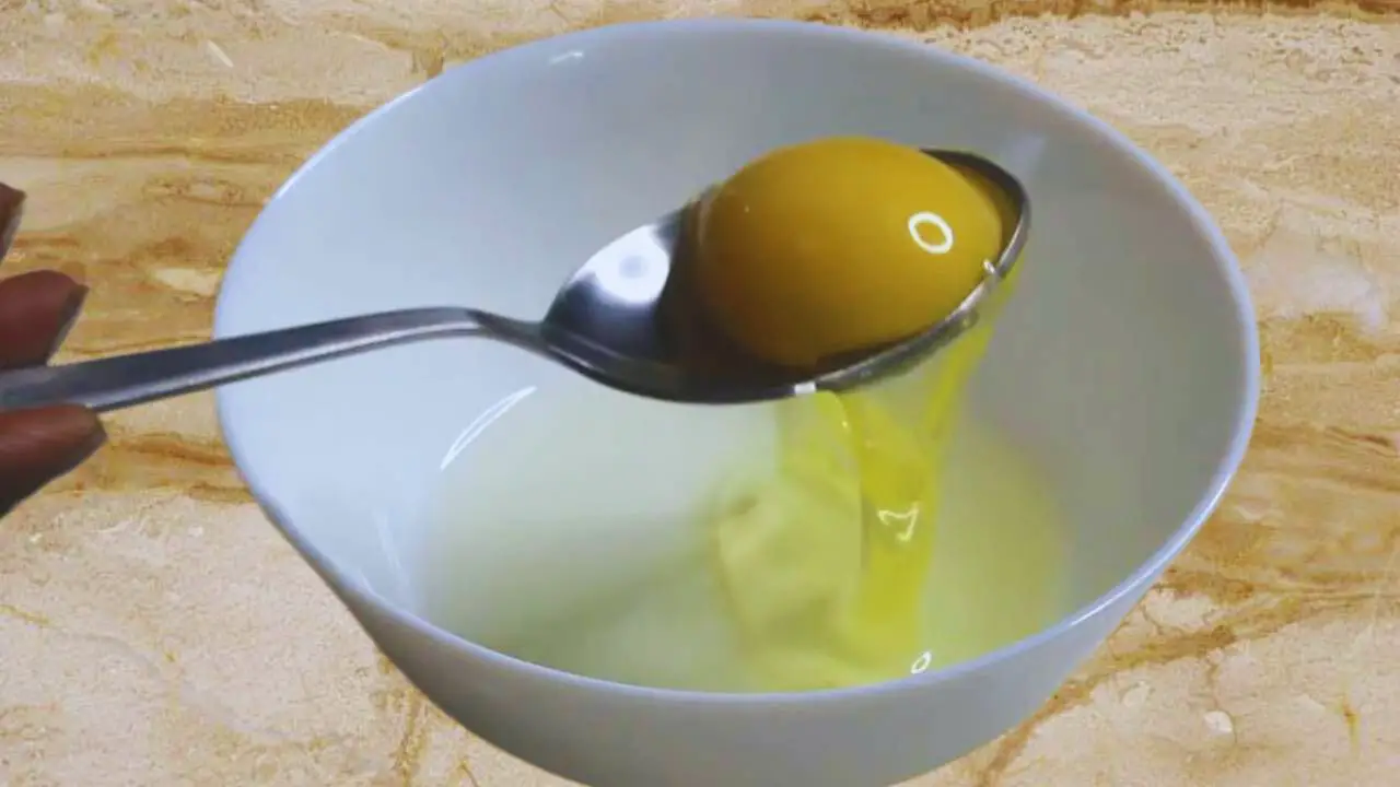 Separating egg white and yolk to use in the chicken finger mixture 