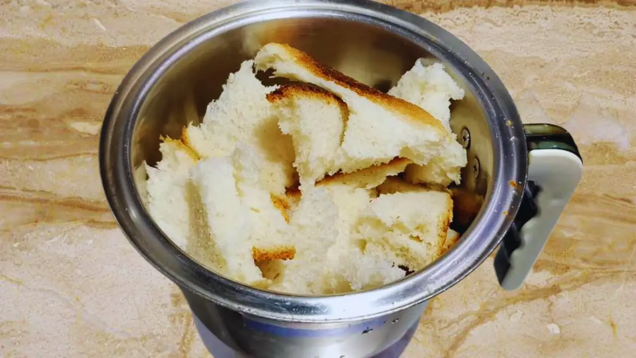 Torn bread slices to make bread crumbs 