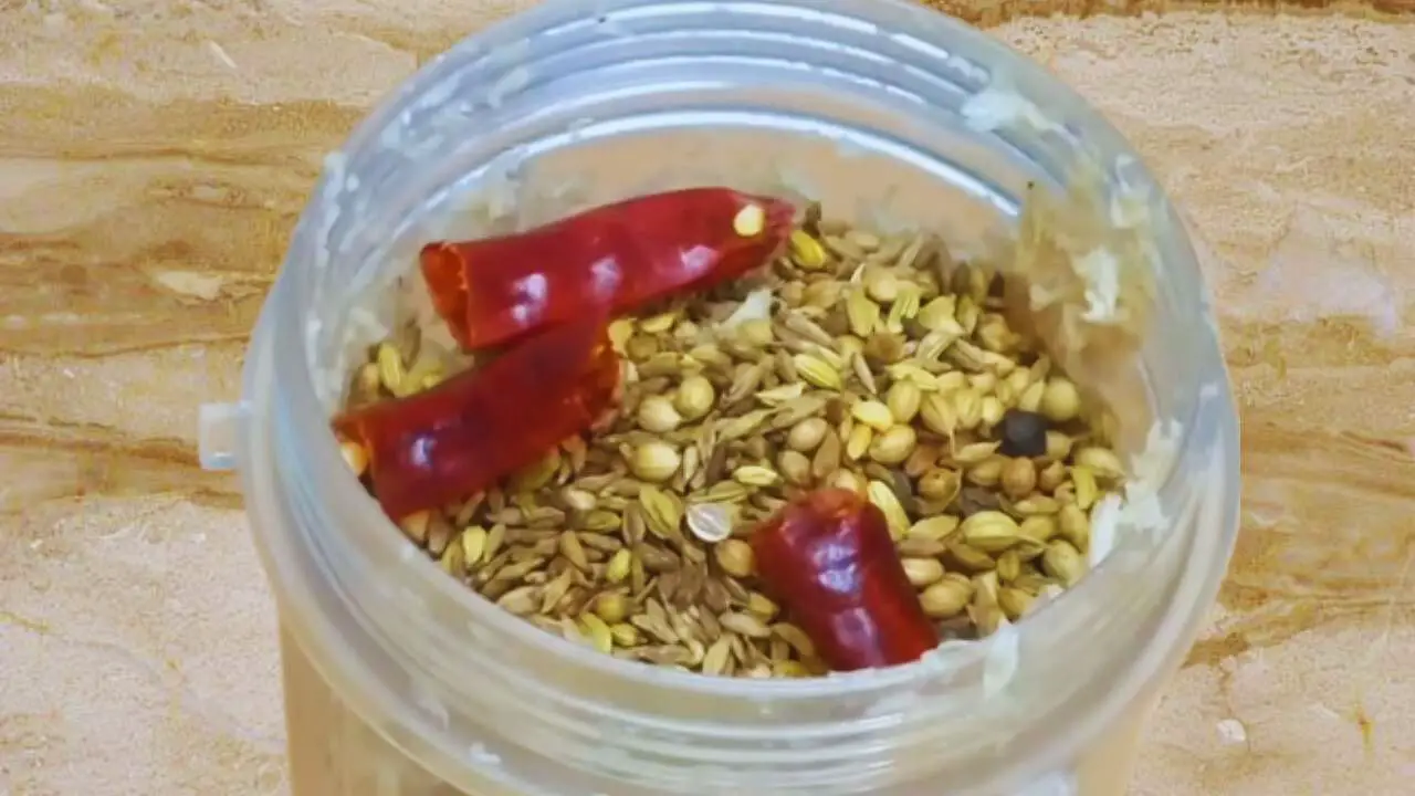 Transferring spices to the grinder