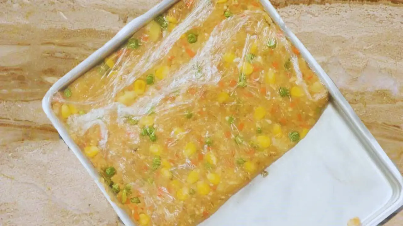 Covering vegetable finger mixture with a wrapper