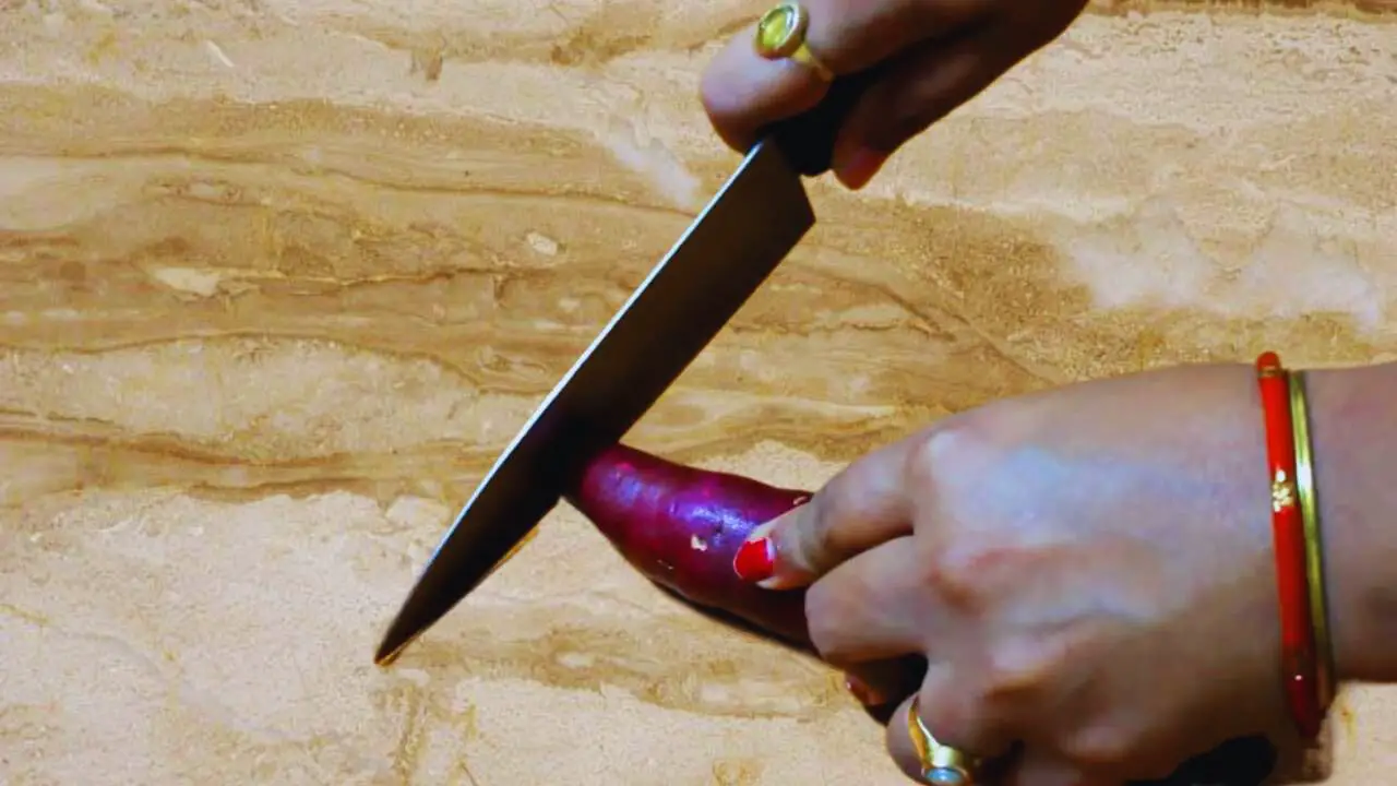 Cutting sweet potato to make the cutlets