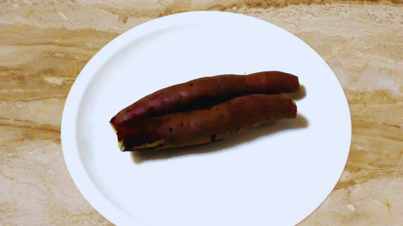 Cooling boiled sweet potato before peeling and shaping the cutlets 