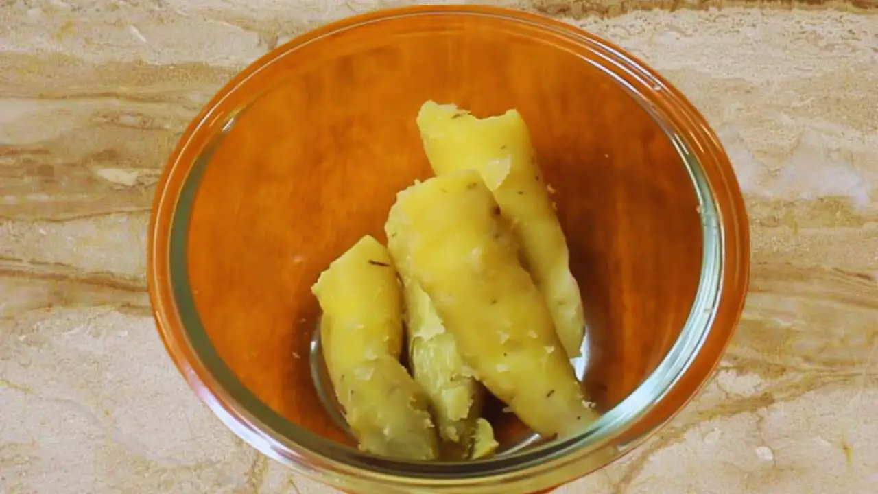 Peeled sweet potato in bowl before mixing the ingredients for making the cutlets 