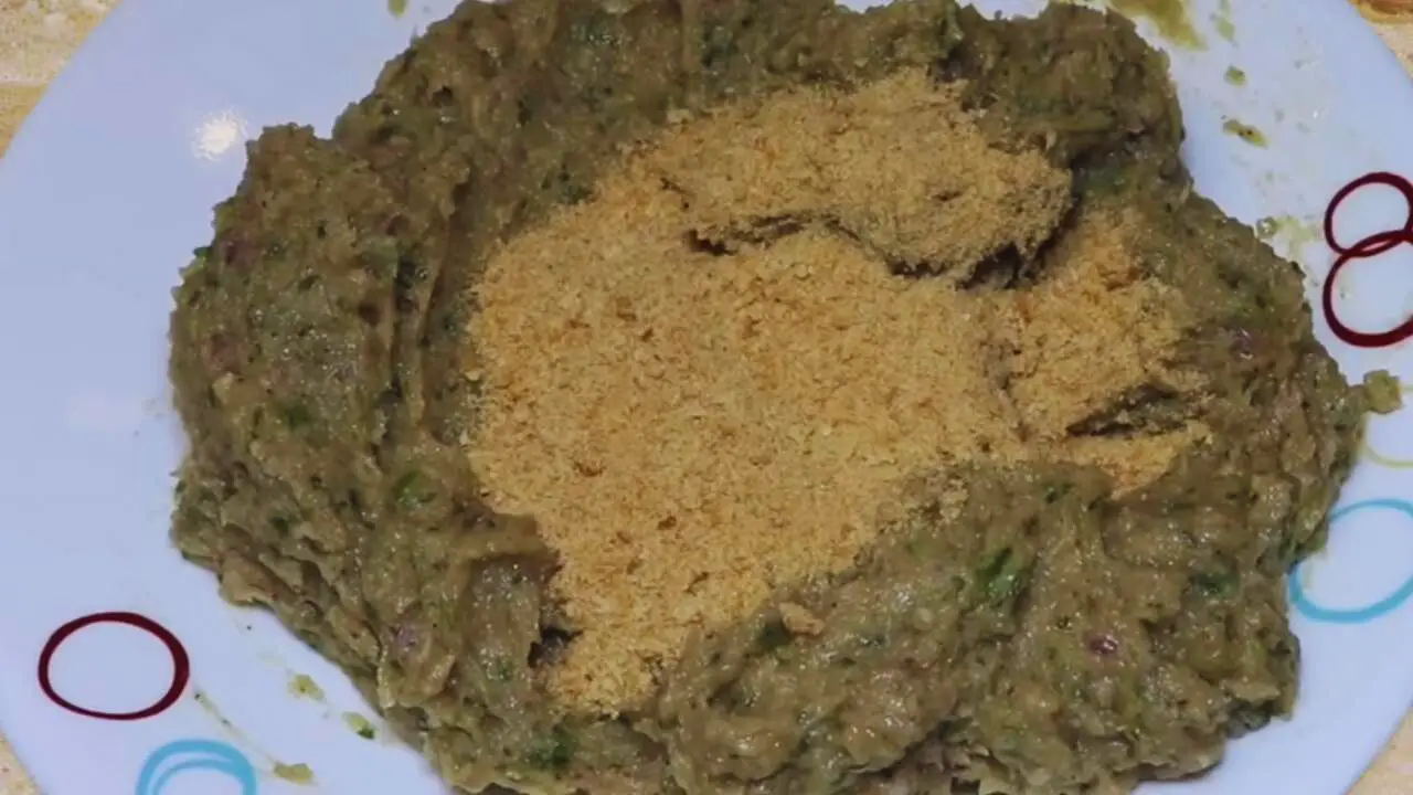 Adding bread crumbs to Chicken Cutlet paste