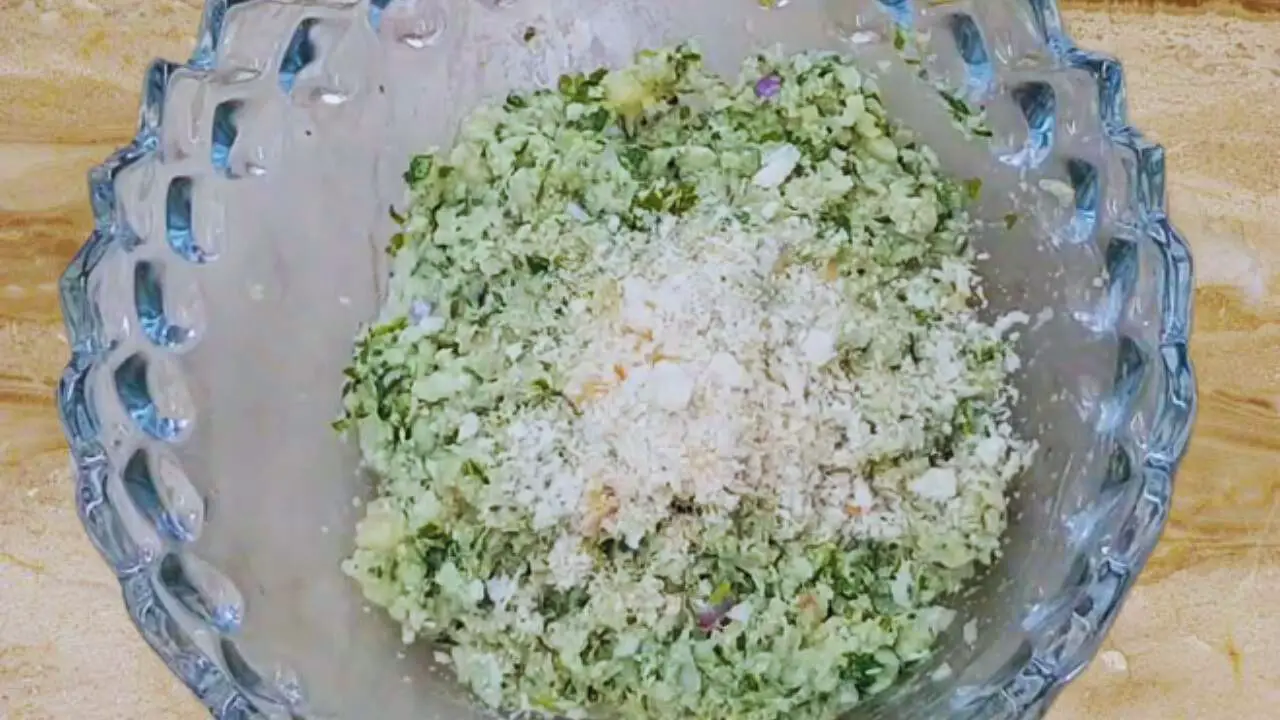 Adding bread crumbs to prawn kabab mixture