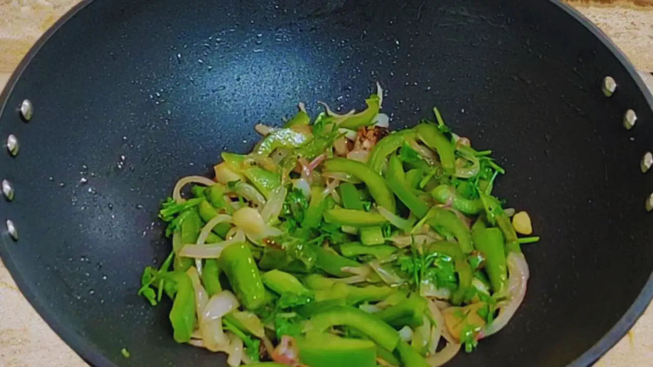 Adding capsicum and cooking till soft 